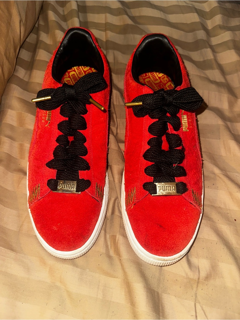 Puma Red Suede Low-Top Sneakers with Black Laces and Gold Accents